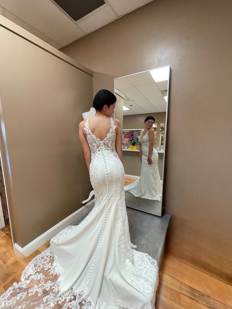 A fitted white lace wedding gown altered at Abuela’s Alterations